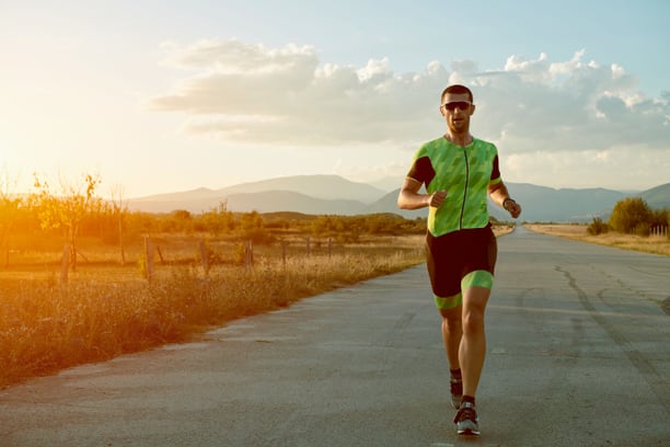 Triathlete running during training — authentic sport photography