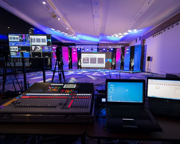 Live event production setup with cameras and stage lighting